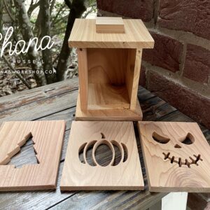 Wood lantern with interchangeable seasonal faces for christmas, thanksgiving and halloween
